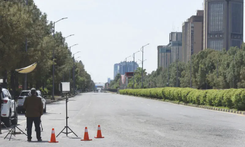 Jinnah Avenue stands deserted as strict security measures bring life to a halt in Islamabad on Friday ahead of US-Iran talks. &mdash; Photo by Tanveer Shahzad