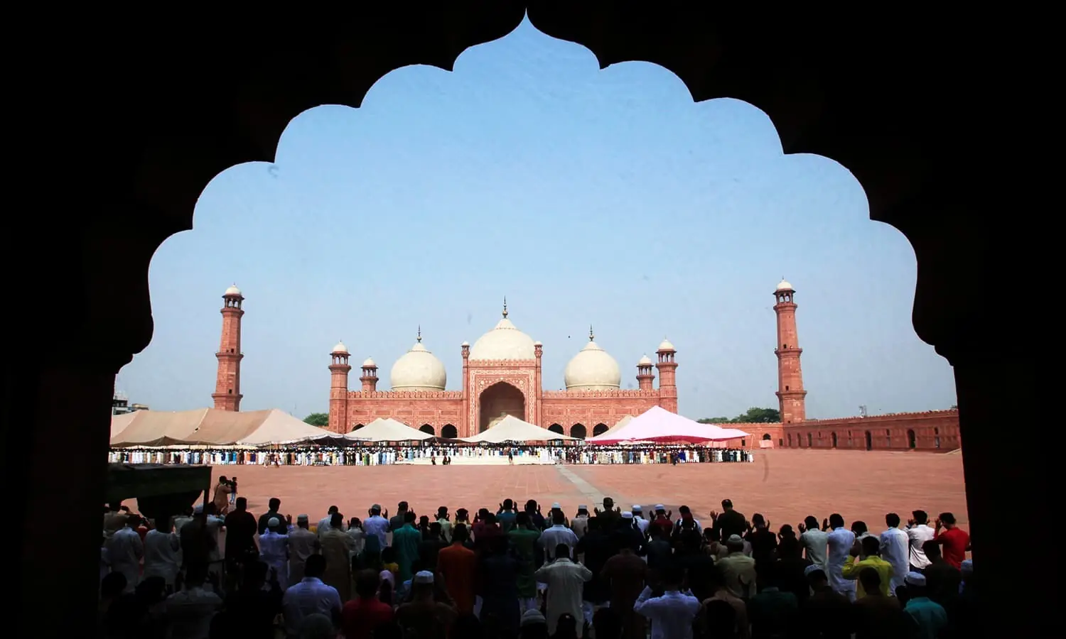 Men say their prayers during Eid al-Fitr to mark the end of the holy fasting month of Ramazan at the Badshahi mosque in Lahore, Pakistan June 26, 2017. — Reuters/File Men say their prayers during Eid al-Fitr to mark the end of the holy fasting month of Ramazan at the Badshahi mosque in Lahore, Pakistan June 26, 2017. — Reuters/File