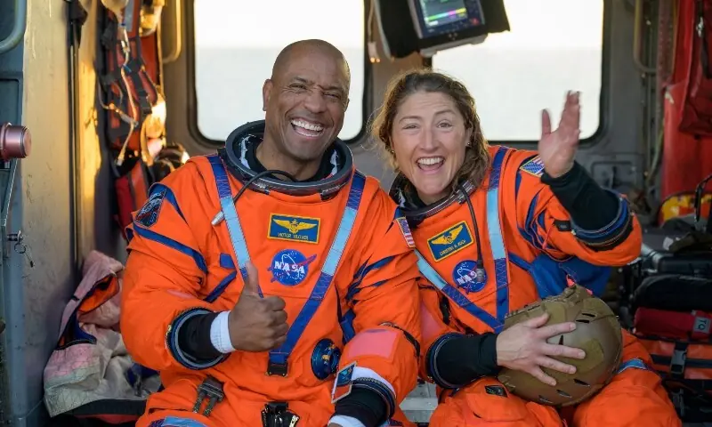 NASA astronaut Victor Glover, Artemis II pilot, and NASA astronaut Christina Koch, Artemis II mission specialist react while sitting on a Navy MH-60 Seahawk from Helicopter Sea Combat Squadron (HSC) in the Pacific Ocean off the coast of California, US April 10, 2026. —Reuters