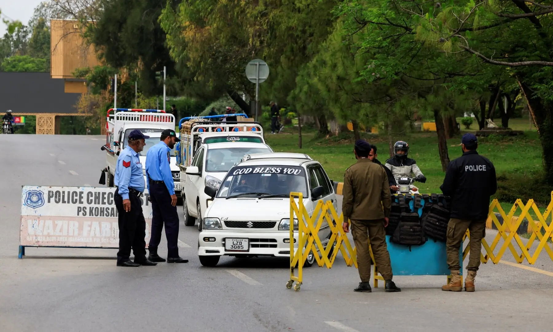 Police officers check vehicles as part of security measures on a road leading to the Red Zone, an area with government offices, as delegations from the United States and Iran are expected to hold high-stakes talks, in Islamabad, Pakistan, April 11, 2026. &mdash;AFP
