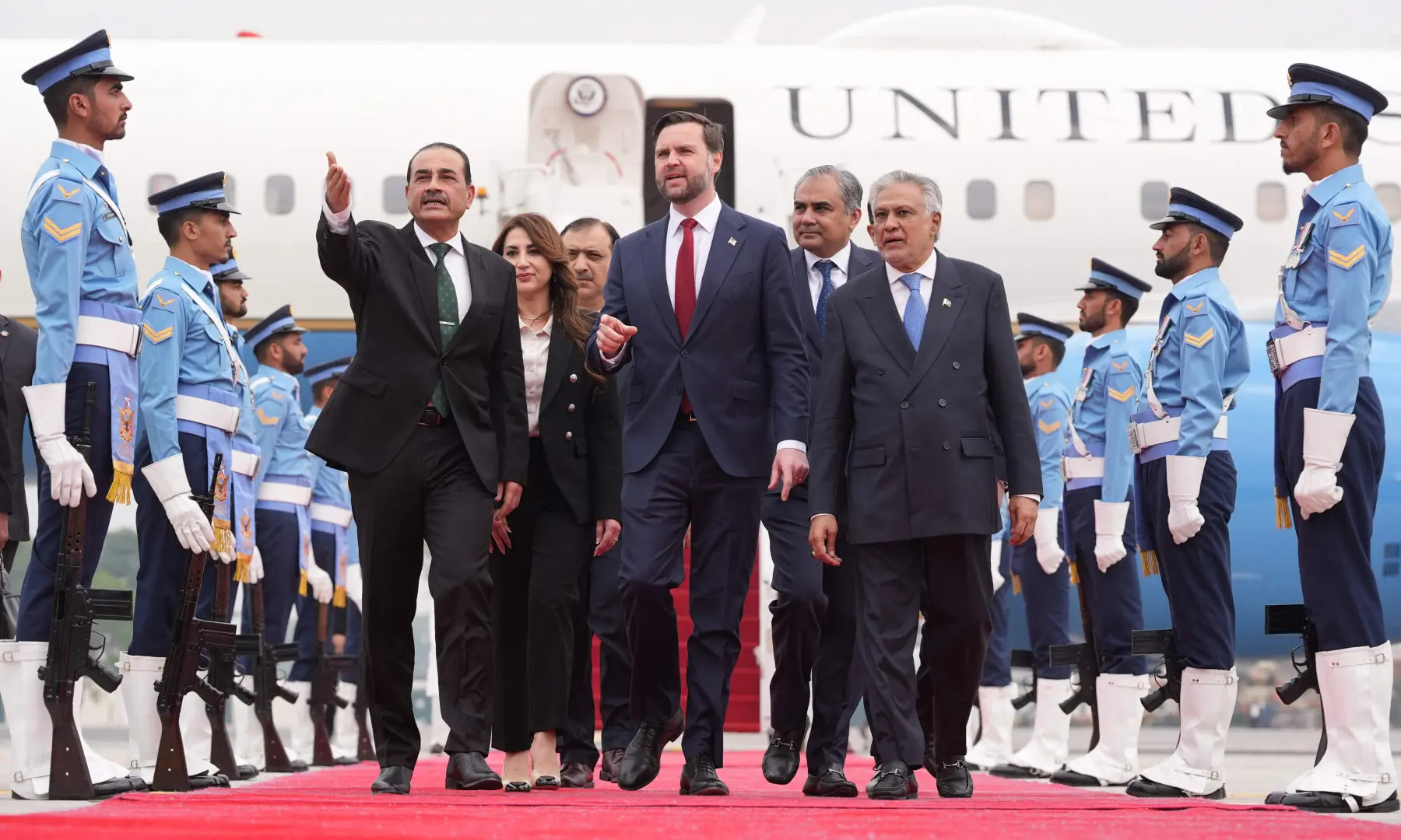 US Vice President JD Vance (C) walks with Chief of Defence Forces Field Marshal Asim Munir (L) and Deputy Prime Minister Ishaq Dar after arriving for talks with Iranian officials in Islamabad on April 11, 2026. &mdash; AFP