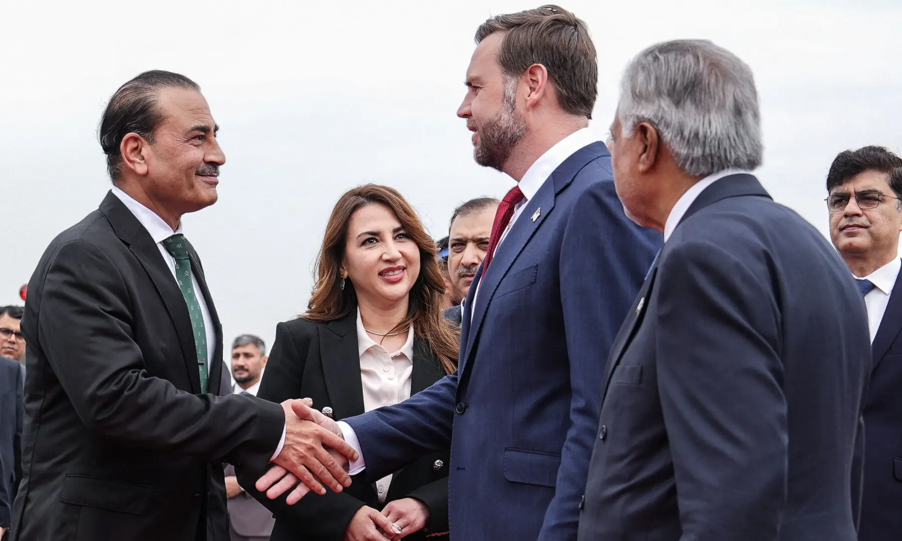 US Vice President JD Vance (2R) shakes hands with CDF Field Marshal Syed Asim Munir (L) after arriving for the US-Iran peace talks in Islamabad on April 11, 2026. &mdash; AFP
