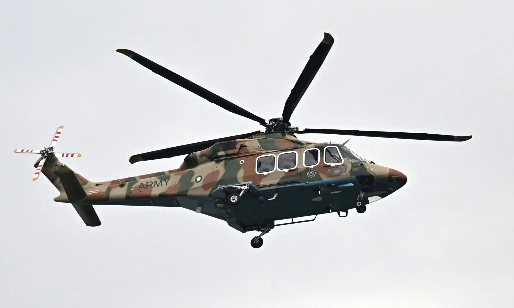A Pakistani army helicopter flies over the Red Zone area ahead of US-Iran peace talks in Islamabad on April 11, 2026. &mdash;AFP