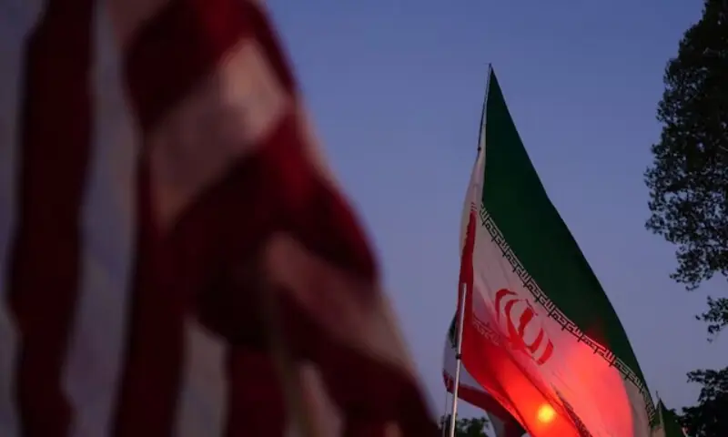 Demonstrators wave flags during a protest against military action in Iran after US President Donald Trump said that he had agreed to a two-week ceasefire with Iran. &mdash;Reuters