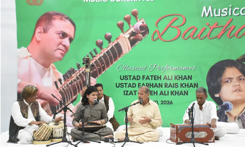 Ustad Fateh Ali Khan, along with his son, Izzat Fateh Ali, performs at the event.—Dawn Ustad Fateh Ali Khan, along with his son, Izzat Fateh Ali, performs at the event.—Dawn