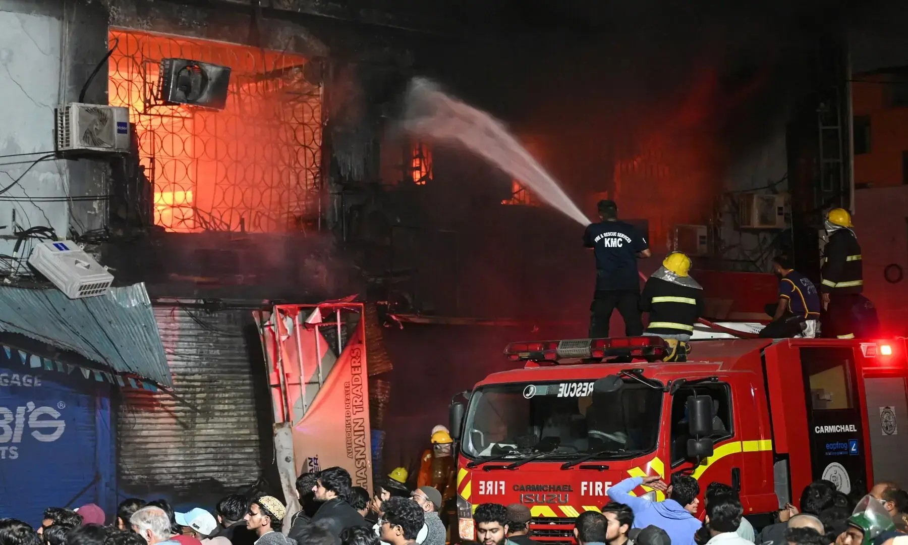 Firefighters douse a fire that broke out at Gul Plaza in Karachi on January 18, 2026. &mdash; AFP/File