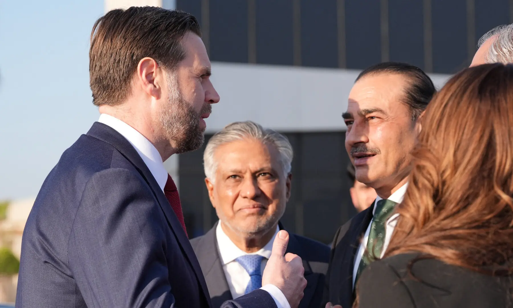 US Vice President JD Vance talks to Field Marshal Asim Munir and Deputy Prime Minister and Foreign Minister Ishaq Dar, before boarding Air Force Two, after peace talks with Iran in Islamabad on April 12, 2026. &mdash; Pool via Reuters