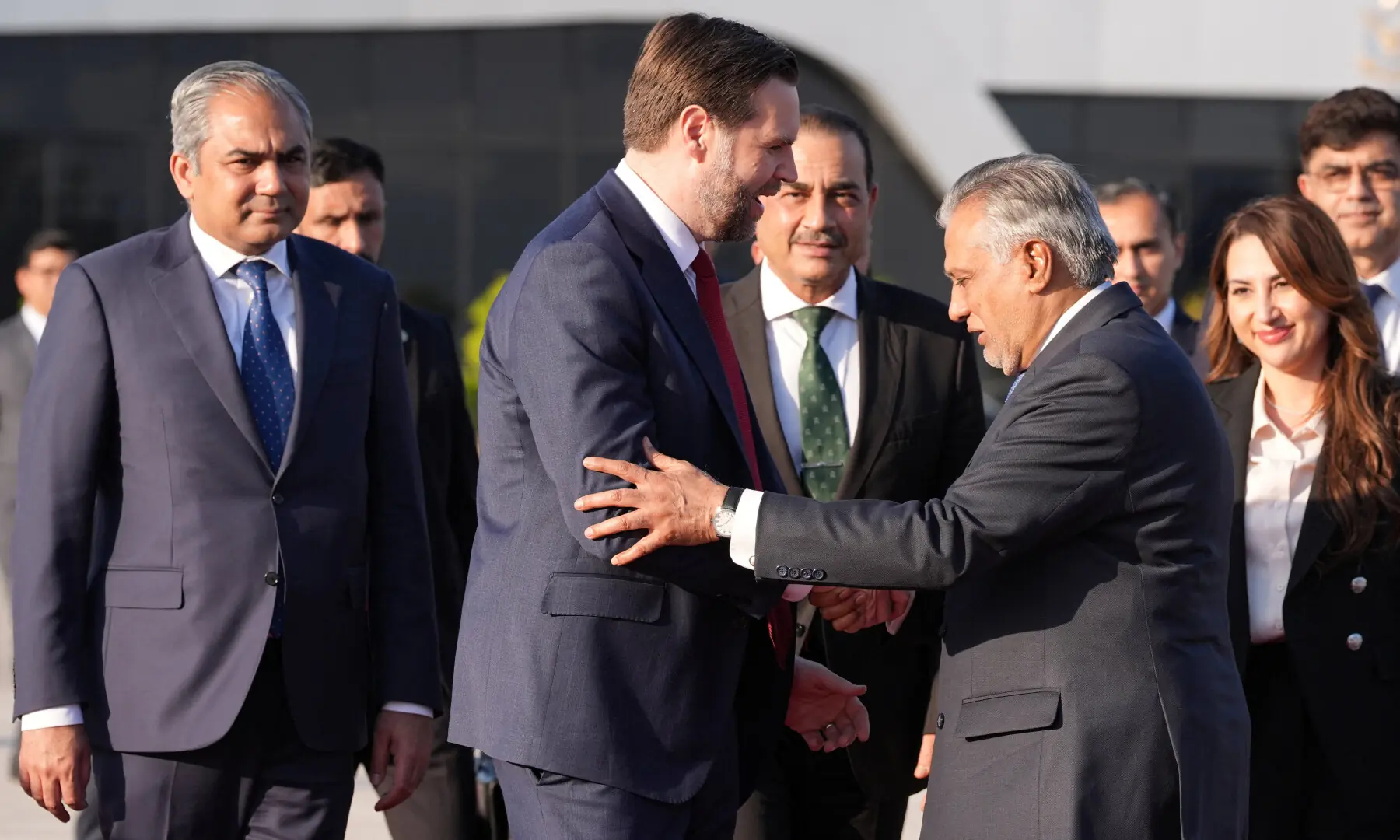 US Vice President JD Vance shakes hands with Deputy Prime Minister and Foreign Minister Ishaq Dar, as he prepares to board Air Force Two, after peace talks with Iran in Islamabad on April 12, 2026. &mdash; Pool via Reuters