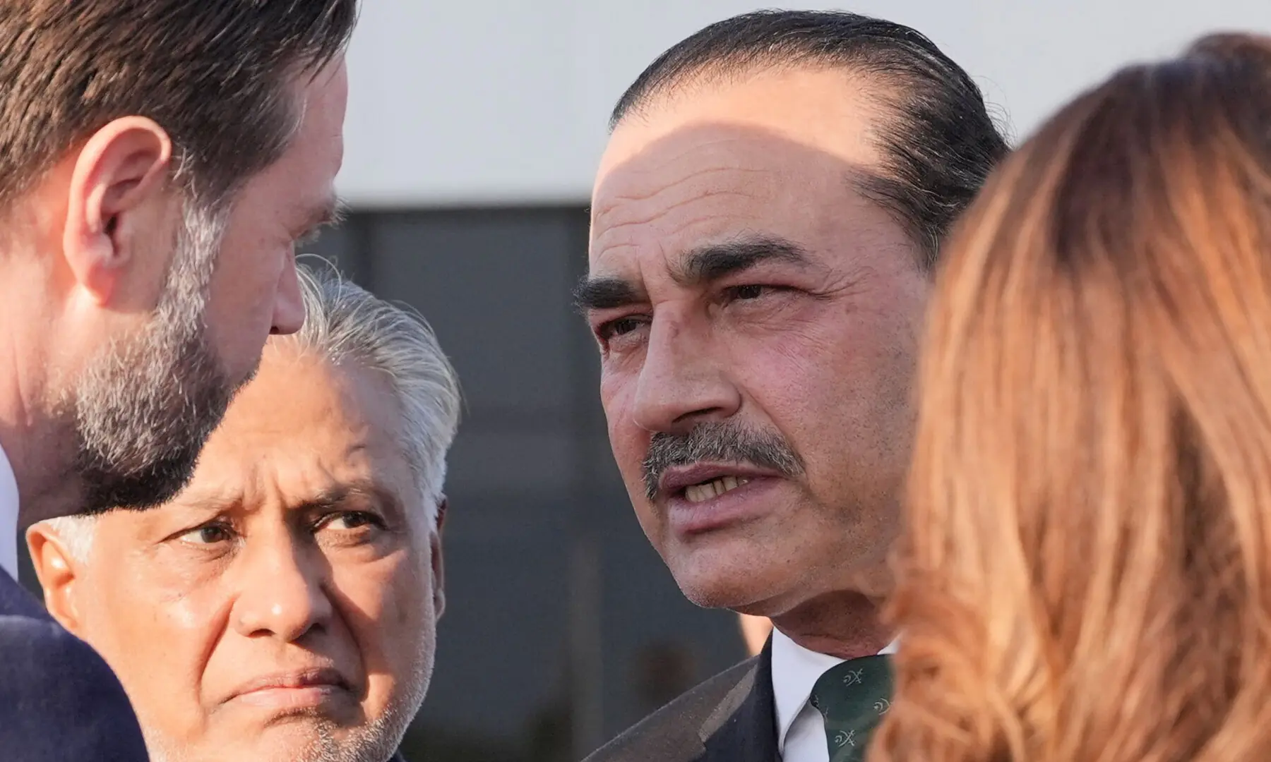 US Vice President JD Vance (L) talks to CDF Field Marshal Asim Munir (R) and Deputy Prime Minister Ishaq Dar (C) before boarding Air Force Two after attending talks on Iran in Islamabad on April 12, 2026. &mdash; AFP