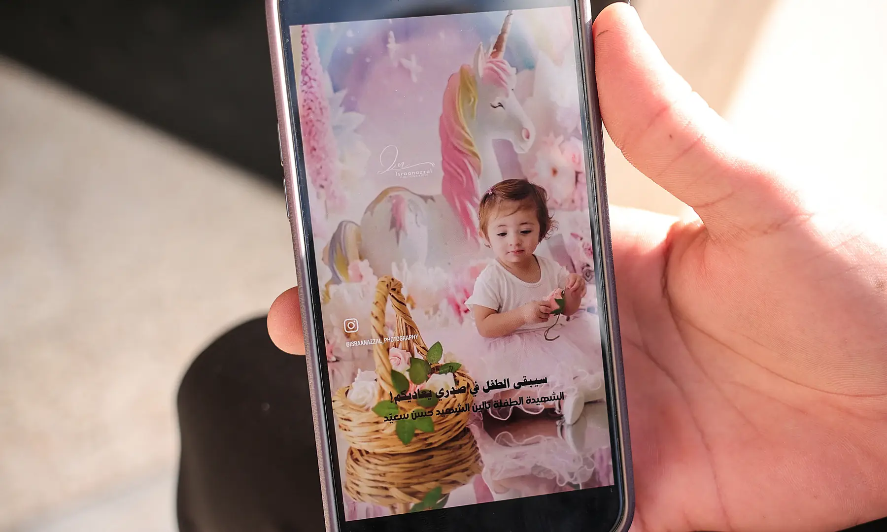 IRAN-CRISIS/LEBANON-FUNERAL Full View Aunt of Taleen, 1.5 years old, who was killed in an Israeli strike in the village of Srifa along with three other members of the Saeed family, holds a phone with a picture of Taleen during their funeral service, at the Al Kharab mosque in Tyre, Lebanon on April 12, 2026. — Reuters