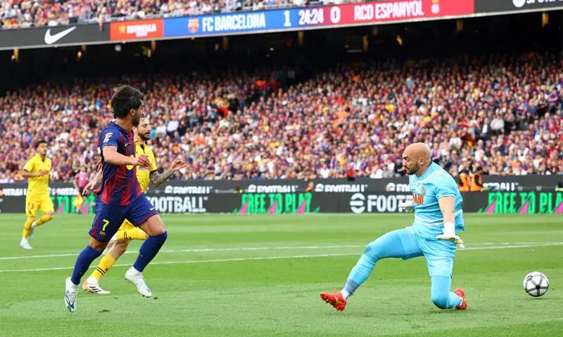 BARCELONA: Ferran Torres of Barcelona scores past Espanyol goalkeeper Marko Dmitrovic during their La Liga match at Camp Nou.&mdash;Reuters