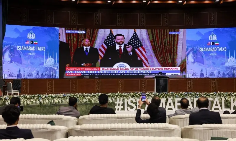 A screen displays U.S. Vice President JD Vance, who is leading a US delegation participating in peace talks with Iran, addressing a press briefing in Islamabad, Pakistan April 12, 2026.  &mdash;Reuters