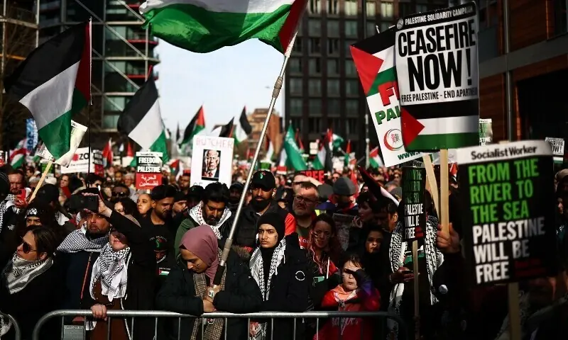 Pro-Palestinian activists and supporters wave flags and hold placards as they gather near the US Embassy following a march through London, during a National Day of Action for Palestine on March 9, 2024. — AFP/File Pro-Palestinian activists and supporters wave flags and hold placards as they gather near the US Embassy following a march through London, during a National Day of Action for Palestine on March 9, 2024. — AFP/File