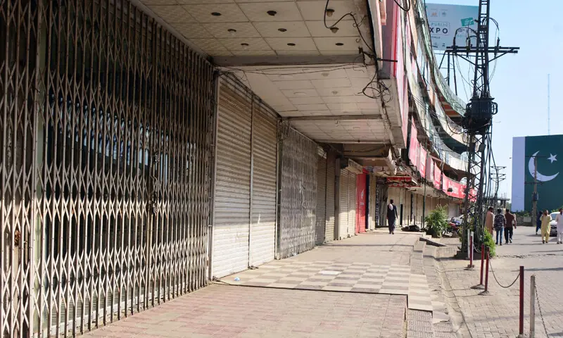 Shops at Moti Mahal in Rawalpindi remain closed under a complete shutdown of markets, businesses and commercial outlets on Sunday. — Online Shops at Moti Mahal in Rawalpindi remain closed under a complete shutdown of markets, businesses and commercial outlets on Sunday. — Online