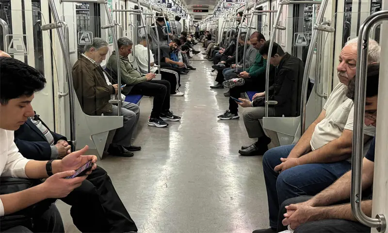 Commuters travel on a metro train in Tehran.&mdash;AFP