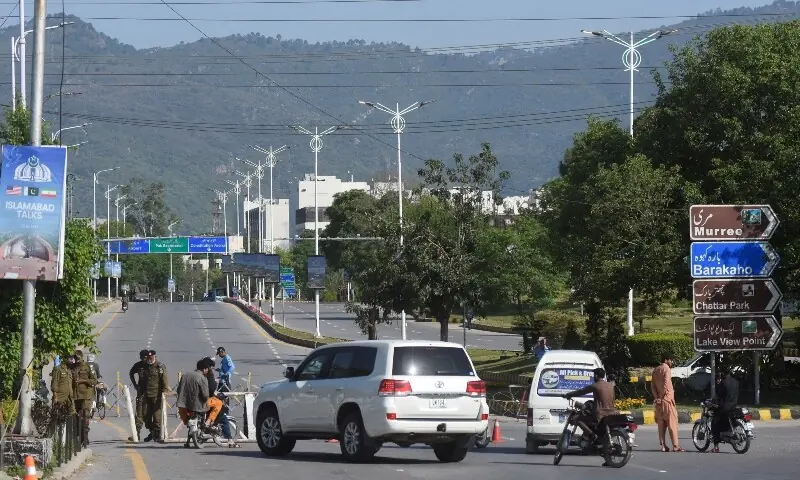 Security personnel check vehicles at a checkpoint near Serena Hotel following US and Iran peace talks in Islamabad, Pakistan, April 12, 2026. &mdash;Reuters