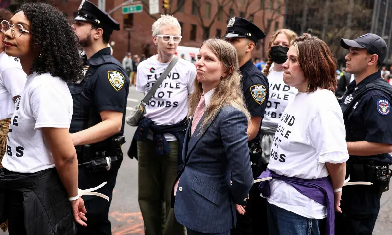 Activist Chelsea Manning (C) and other protesters are arrested by police during a demonstration and sit-in on Third Avenue in New York City on April 13, 2026. — AFP Activist Chelsea Manning (C) and other protesters are arrested by police during a demonstration and sit-in on Third Avenue in New York City on April 13, 2026. — AFP
