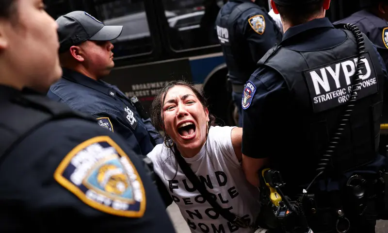 A protester is arrested by police during a demonstration and sit-in on Third Avenue in New York City on April 13, 2026. — AFP A protester is arrested by police during a demonstration and sit-in on Third Avenue in New York City on April 13, 2026. — AFP