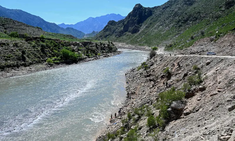 This photograph taken on April 13, 2026 shows Afghan men digging a mountainside along the Kunar riverbed before seiving stones in search of gold nuggets in the Song area of Ghaziabad district, Kunar province. &mdash; AFP