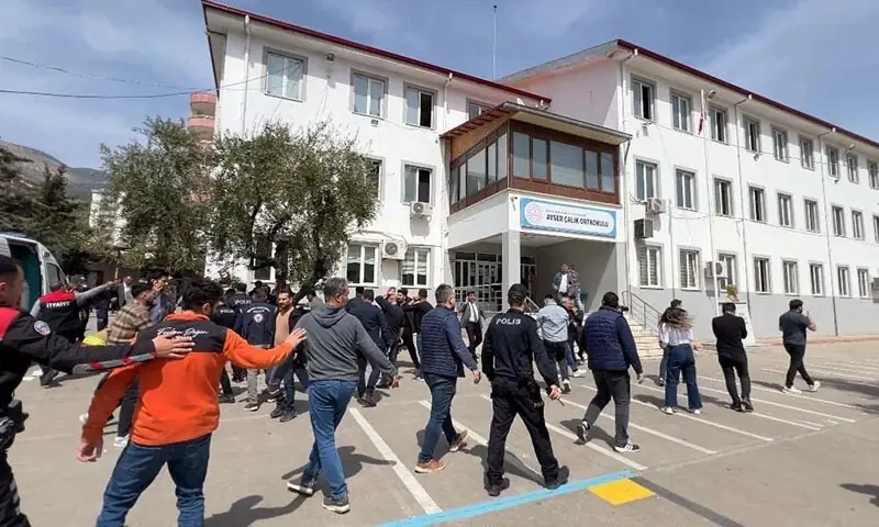 Police officers in uniform and plainclothes police secure the site after a deadly school shooting, in the southeastern province of Kahramanmaras, Turkiye on April 15, 2026. &mdash; Reuters