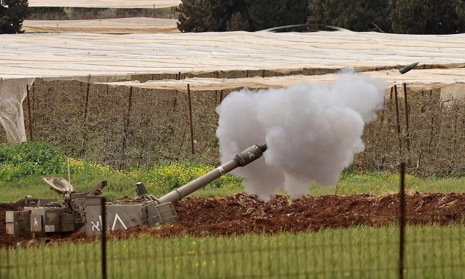 An Israeli self-propelled artillery gun fires rounds towards southern Lebanon from a position in Upper Galilee, northern Israel on April 15, 2026. &mdash; AFP
