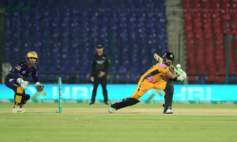 PESHAWAR Zalmi captain Babar Azam plays a shot as Quetta Gladiators wicket-keeper Khawaja Nafay looks on during the Pakistan Super League match at the National Bank Stadium on Wednesday.&mdash;Tahir Jamal/White Star
