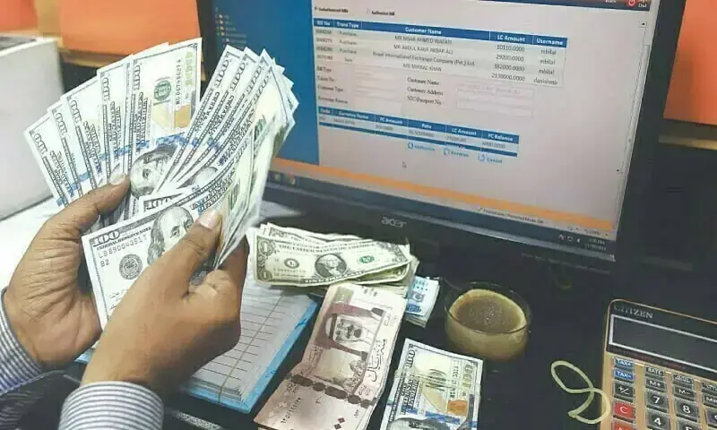 A file photo of US banknotes being counted. — AFP A file photo of US banknotes being counted. — AFP