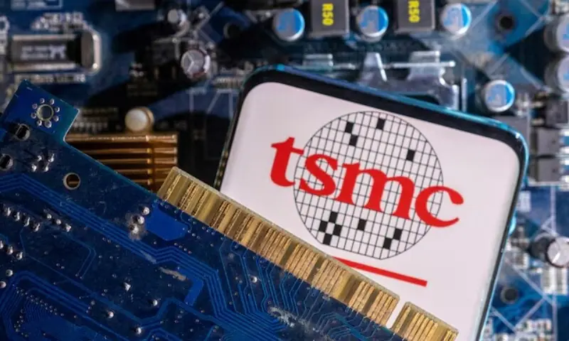 A smartphone with a displayed TSMC (Taiwan Semiconductor Manufacturing Company) logo is placed on a computer motherboard in this illustration taken March 6, 2023. &mdash;Reuters/File