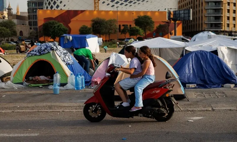 Girls displaced following Israeli evacuation orders ride a scooter at a makeshift encampment in Beirut, Lebanon, April 15, 2026. &mdash;Reuters