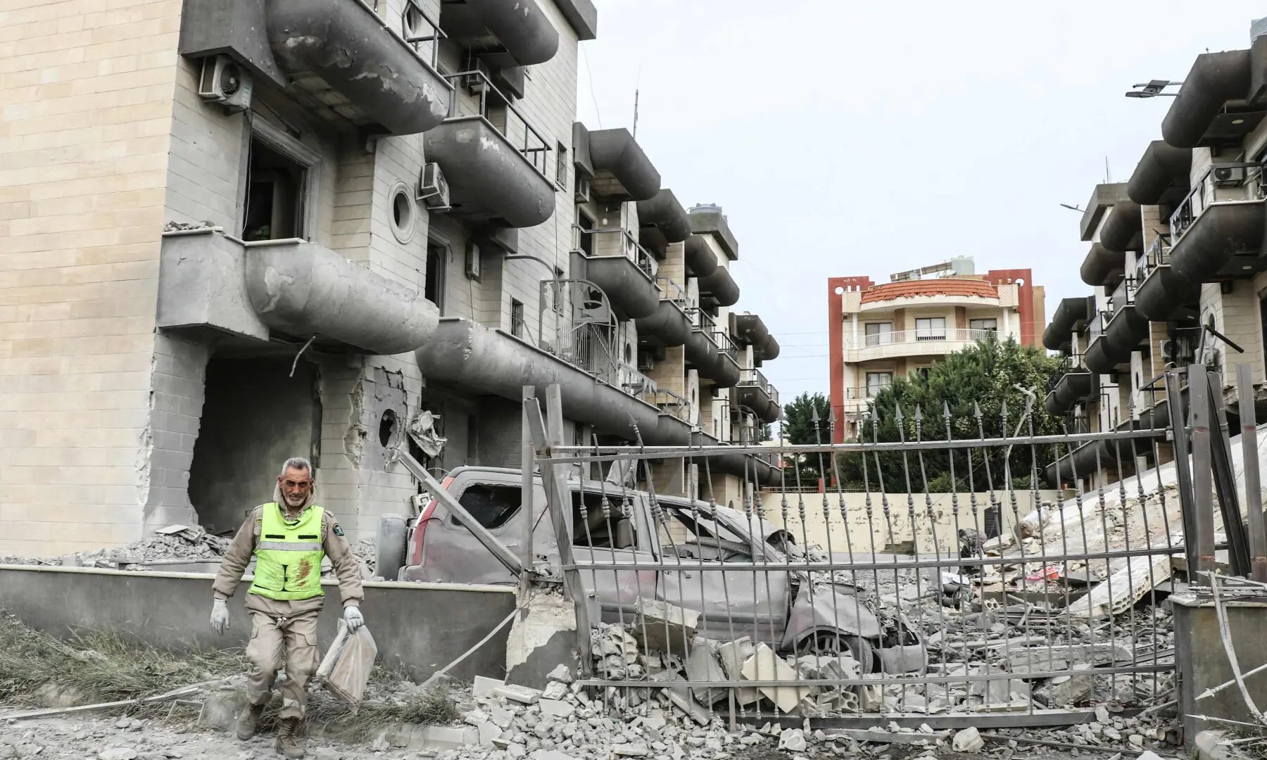 A first responder inspects the site of an Israeli airstrike in the southern Lebanese village of Abbasiyeh, on the outskirts of Tyre, on April 15, 2026. — AFP