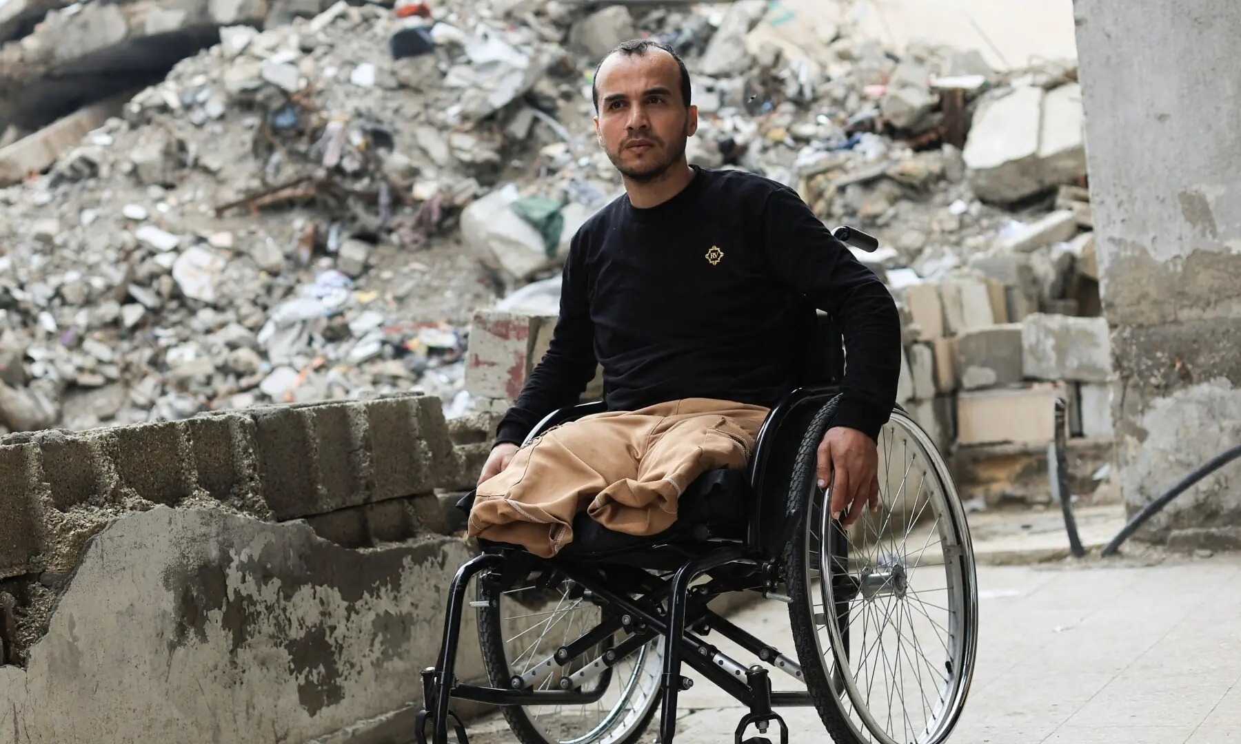 Palestinian amputee Omar Abu Ali, 34, who was injured in an Israeli strike, sits in a wheelchair at his home, in Gaza City on April 1, 2026. &mdash; Reuters