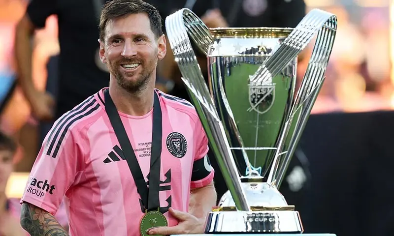 Inter Miami forward Lionel Messi looks on with the Philip F Anschutz trophy after winning the 2025 MLS Cup against the Vancouver Whitecaps FC at Chase Stadium in Fort Lauderdale, Florida on December 6, 2025. &mdash; Reuters/File