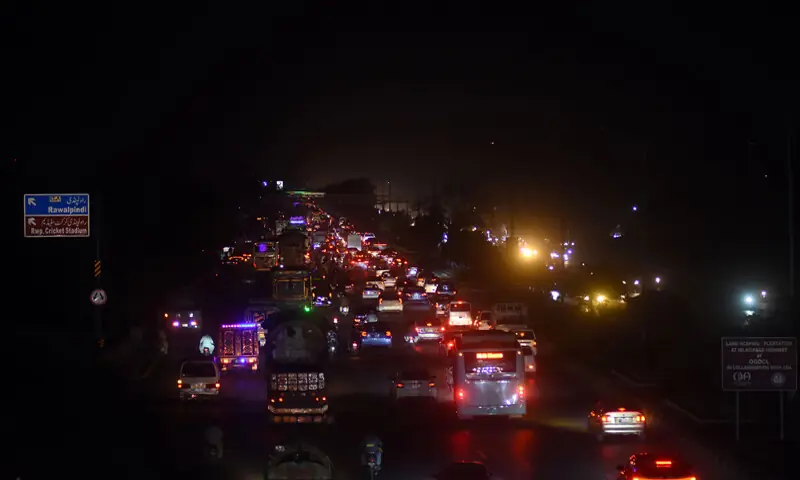 A VIEW of the Islamabad Expressway during a power cut in the federal capital.—Online A VIEW of the Islamabad Expressway during a power cut in the federal capital.—Online