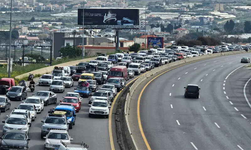 DISPLACED residents drive along a highway in a bid to rush back to their homes, in Rmeileh at the northern entrance of the Lebanese city of Sidon.&mdash;AFP