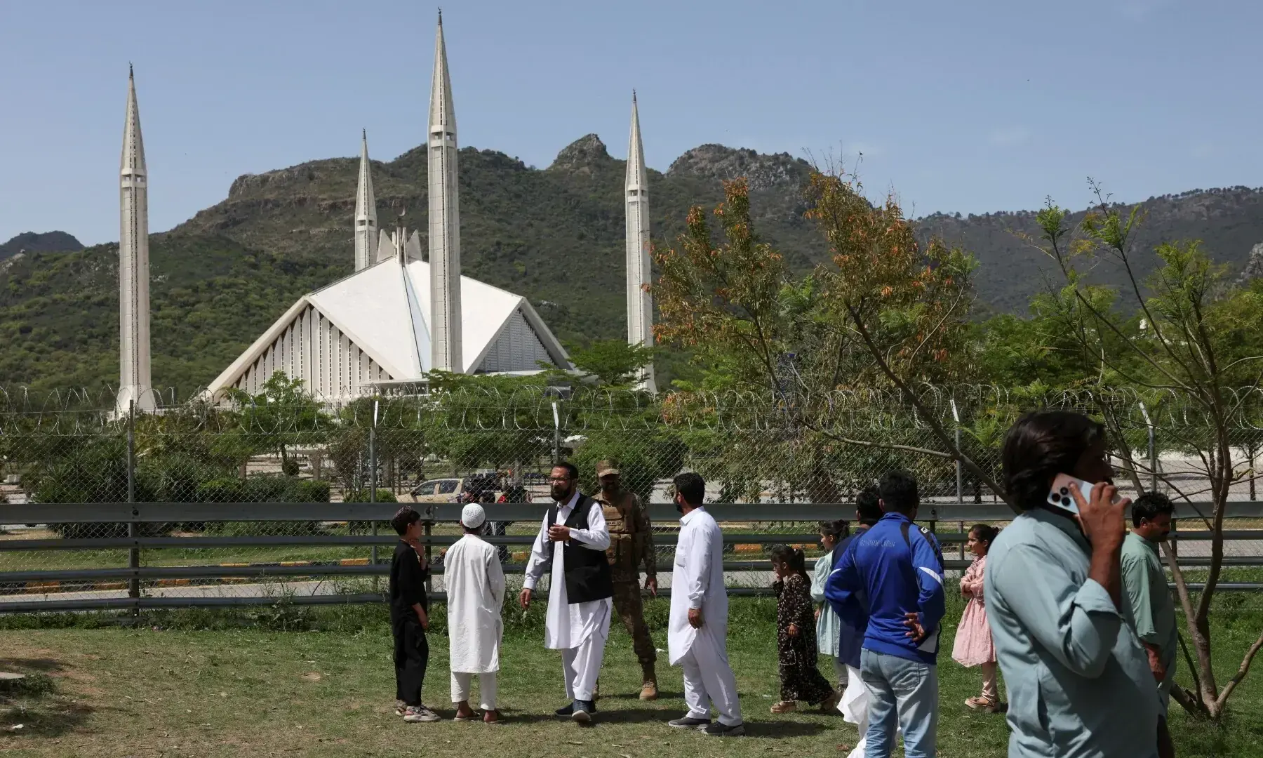 An army soldier disperses locals who arrive to visit Faisal Masjid, for security reasons, as Pakistan prepares to host the US and Iran for peace talks, in Islamabad, Pakistan, April 10, 2026. &mdash;AFP/File