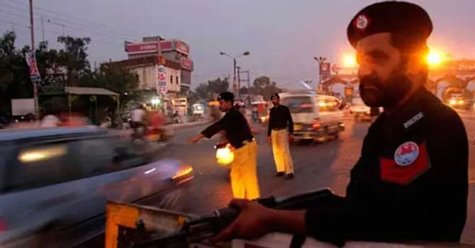 Policemen on a street in Karachi. &mdash;Dawn/File