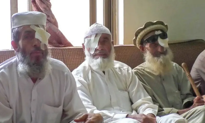 Patients who lost vision after eye surgery sitting in Rahimabad police station. — Dawn/File Patients who lost vision after eye surgery sitting in Rahimabad police station. — Dawn/File