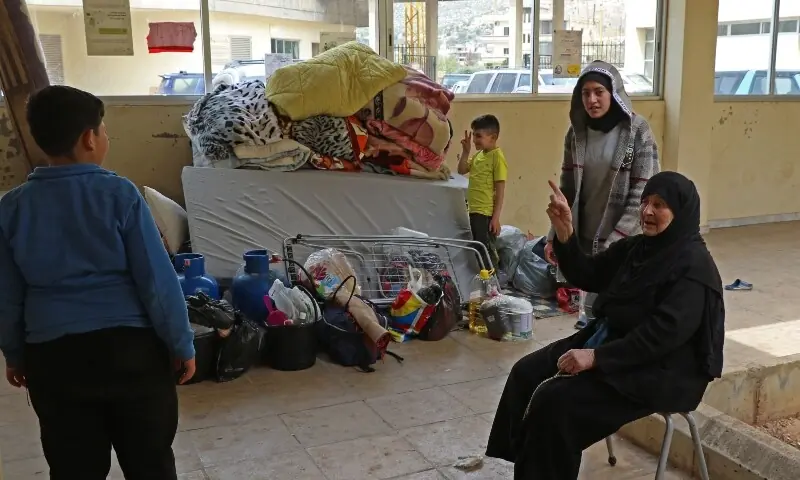 A displaced family sits next to their belongings in a school transformed into a shelter in the central Lebanese village of Deir Al-Ahmar on April 17, 2026. —AFP A displaced family sits next to their belongings in a school transformed into a shelter in the central Lebanese village of Deir Al-Ahmar on April 17, 2026. —AFP