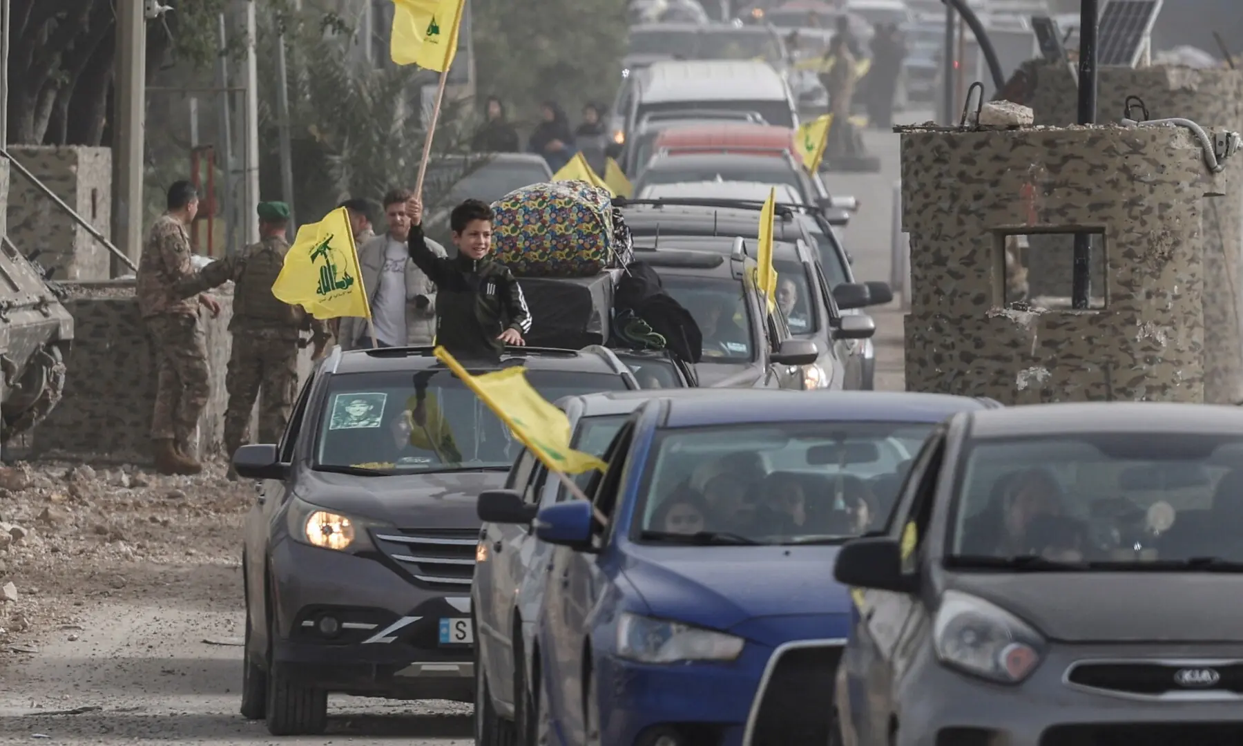 Displaced people make their way back to their homes after crossing the bridge linking southern Lebanon to the rest of the country, following the ceasefire between Lebanon and Israel in Qasmiyeh, Lebanon on April 18, 2026. &mdash; Reuters