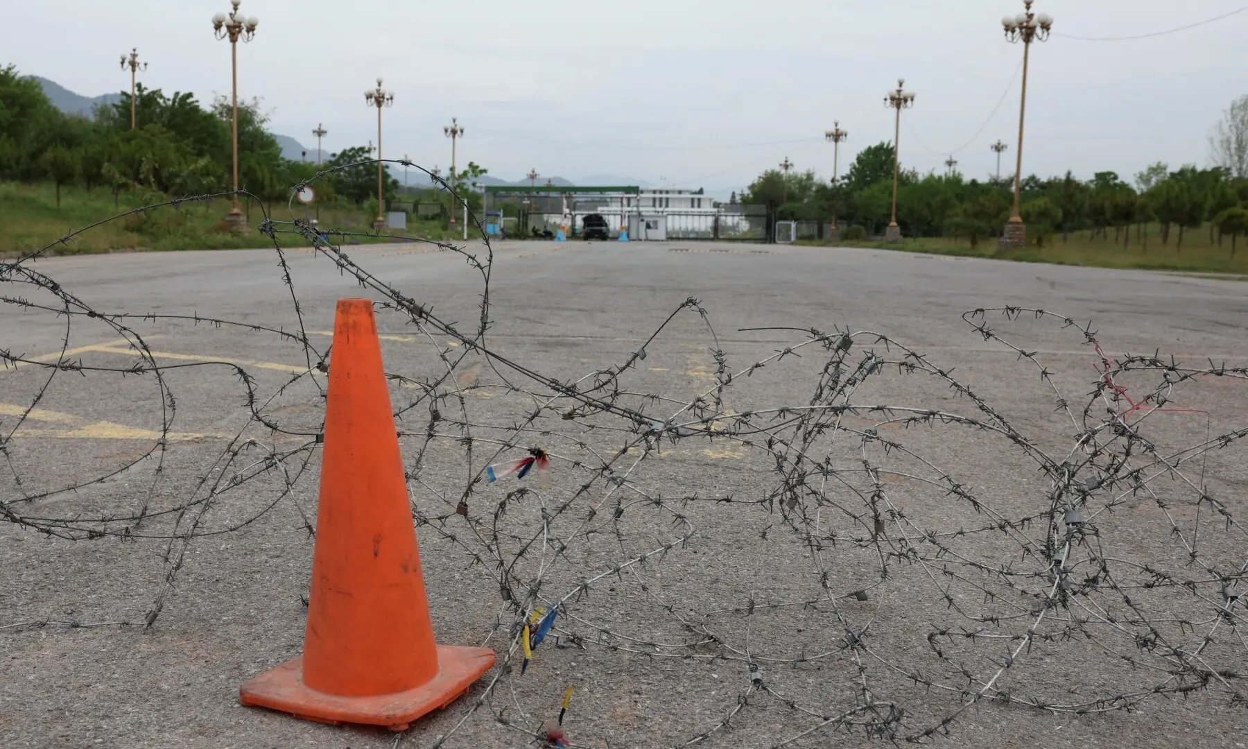 Barbed wire blocks a road leading to the President&rsquo;s House, as Pakistan prepares to host the US and Iran for the second phase of peace talks in Islamabad, on April 18, 2026. &mdash;Reuters