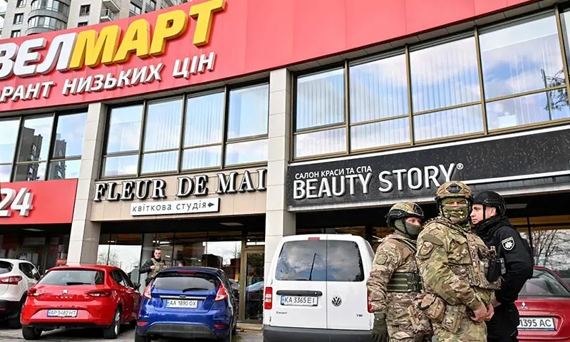 Police personnel stand outside a supermarket following a shooting in Kyiv, Ukraine on April 18, 2026. — AFP Police personnel stand outside a supermarket following a shooting in Kyiv, Ukraine on April 18, 2026. — AFP