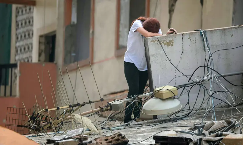 DESPONDENCY overwhelmed a woman after she returned to her damaged home in Beirut&rsquo;s southern suburbs.&mdash;AFP