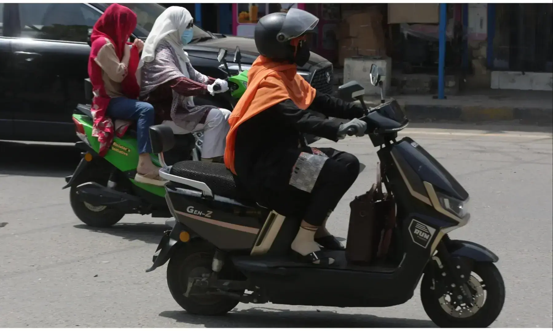 Women riding their scooties on the streets of Lahore. &mdash;Arif Ali/ White Star/File