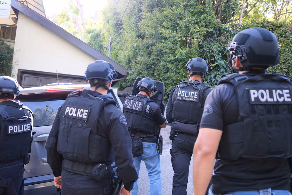 This representational image shows US police officials during a tactical operation. &mdash; Reuters/ File