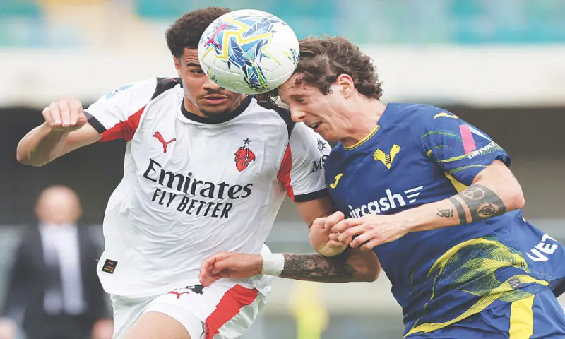 VERONA: AC Milan&rsquo;s Zachary Athekame (L) vies for the ball with Domagoj Bradaric of Hellas Verona during their Serie A match at Stadio Marcantonio Bentegodi on Sunday.&mdash;Reuters