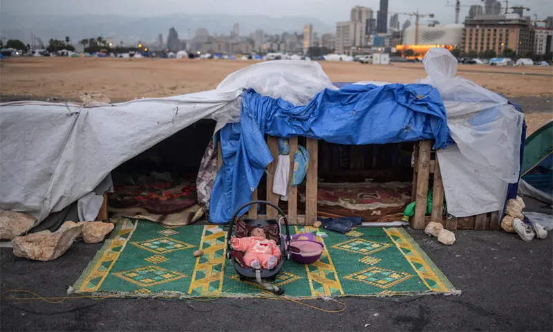 BEIRUT: A two-month-old displaced baby girl lies in her cradle at a makeshift encampment. Many displaced Lebanese people returned home to find their houses reduced to rubble by Israeli attacks.&mdash;Reuters