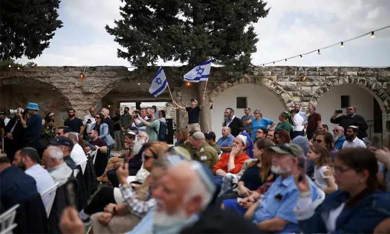 Israeli settlers celebrate the occupation of Sa-Nur settlement on Sunday.—Reuters Israeli settlers celebrate the occupation of Sa-Nur settlement on Sunday.—Reuters