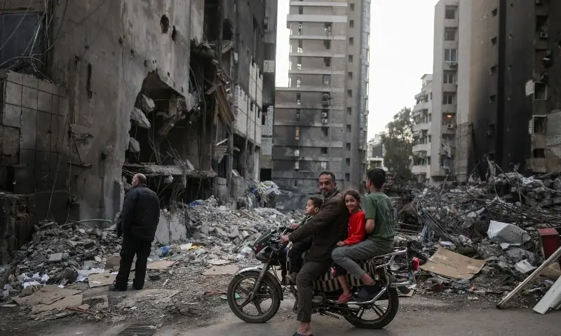 A family visits the site of an Israeli airstrike, carried out on April 8, following the 10-day ceasefire between Lebanon and Israel, at Corniche al-Mazraa in Beirut, Lebanon, April 19, 2026.  &mdash;Reuters