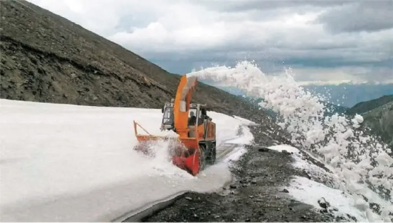 A snow removing machine clears last portion of Mansehra-Naran-Jalkhad Road on Monday. &mdash; Dawn/File