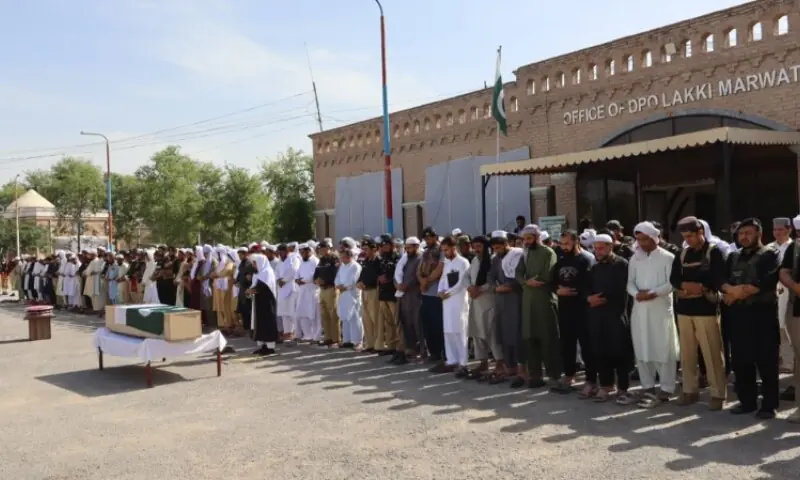 Funeral prayers of the martyred policeman being offered in Lakki Marwat. —Photo by author